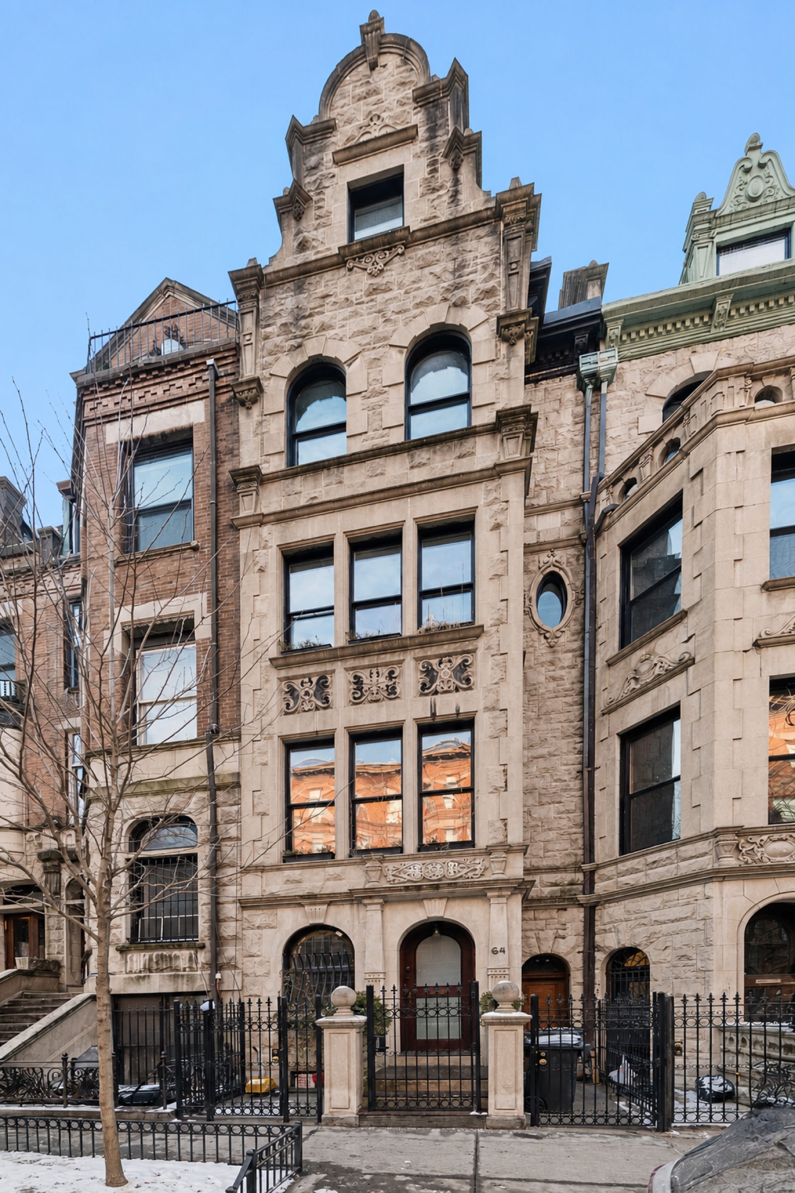 Jacobean Revival limestone facade of 64 West 87th Street